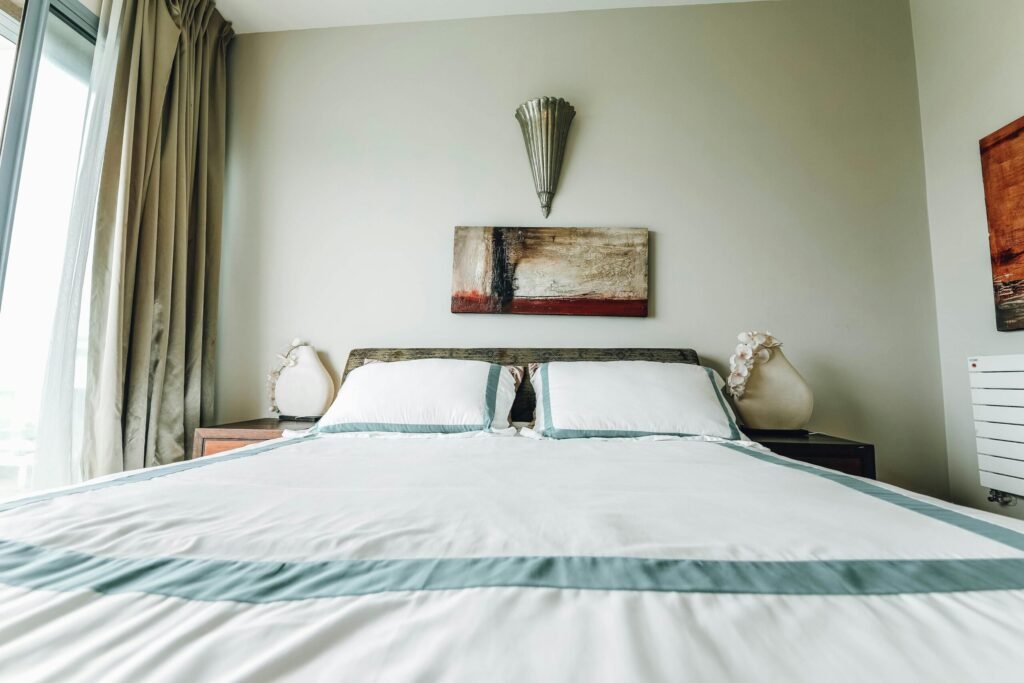 A stylish bedroom featuring contemporary furnishings and minimalist design.